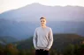 The author of this blog post, Andrew Kepson, standing in front of the Rocky Mountains in Colorado.